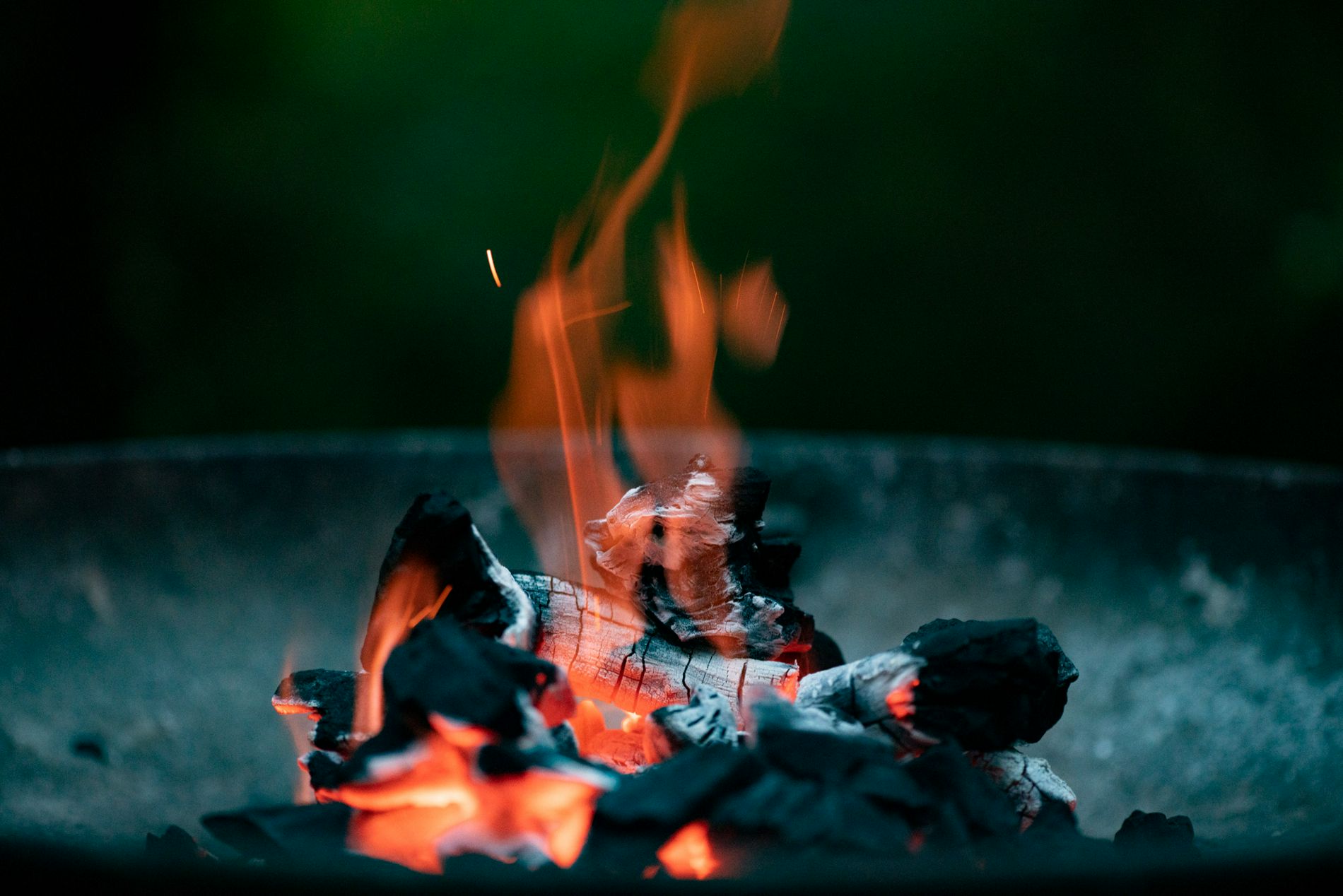 A few coals, on fire, burning, taken up-close